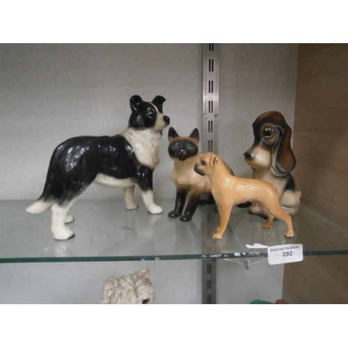 292 - Three dogs and cat figurines