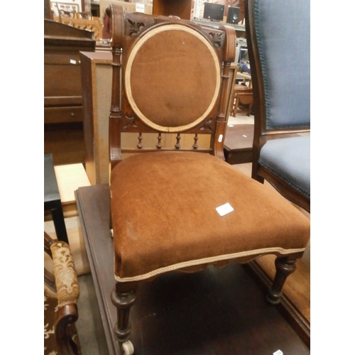 647 - A small vintage nursing chair with upholstered seat pads