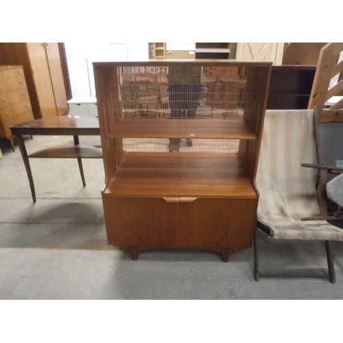 604 - A small retro teak S FORM cabinet