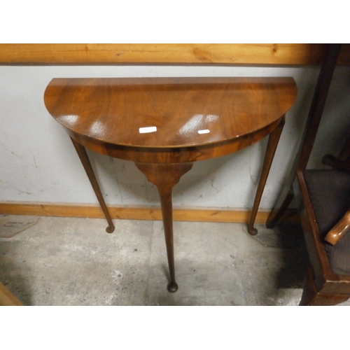 610 - A vintage demi lune table