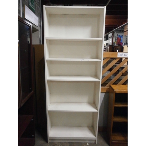 613 - A large white open shelf unit