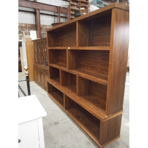 651 - A large solid wooden open shelved wall unit