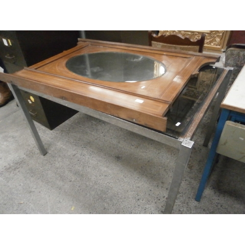 678 - A large metal framed table with glass top and a vintage over mantle mirror with inlaid mahogany surr... 