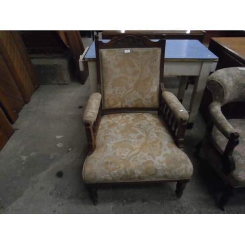 688 - A vintage a/f upholstered salon armchair with carved frame