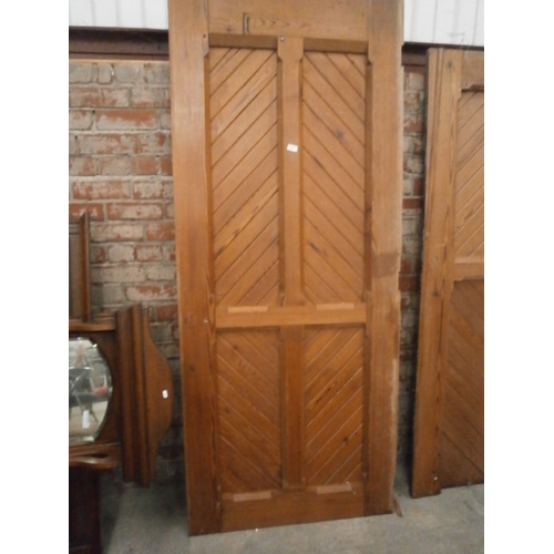 689 - A large vintage pitch pine wall panel