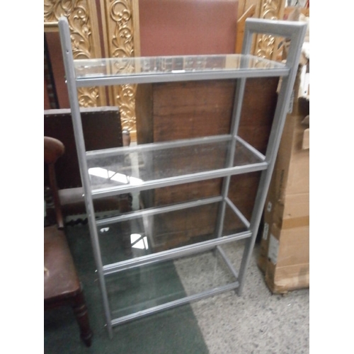 702 - A metal framed 4 tier glass shelf stand