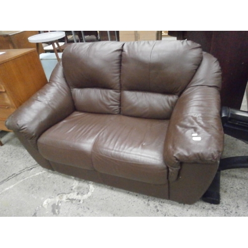 715 - A padded brown leather 2 seater settee