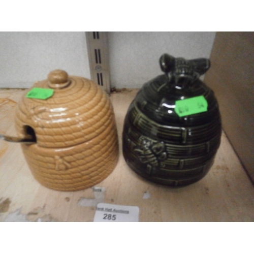 285 - Two assorted honey pots