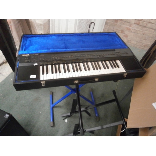 613 - A YAMAHA PSR-60 keyboard and 2 x stands