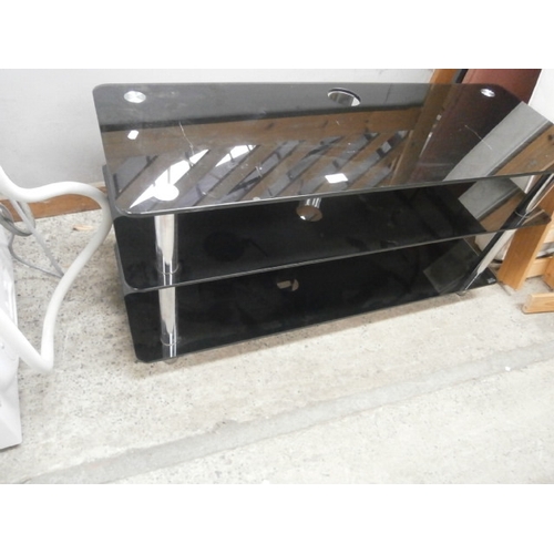 624 - A black glass TV stand