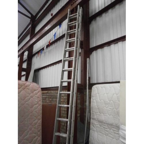 628 - A set of 12ft extending aluminium ladders