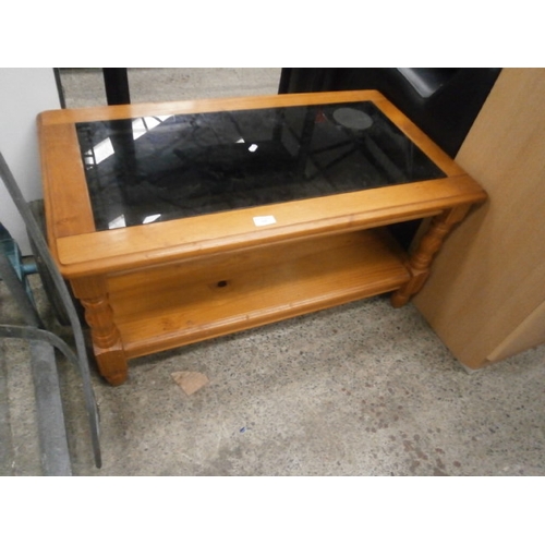 648 - A 2 tier pine coffee table with black glass top