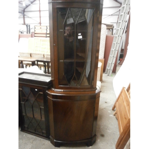 655 - A vintage glazed mahogany corner cabinet