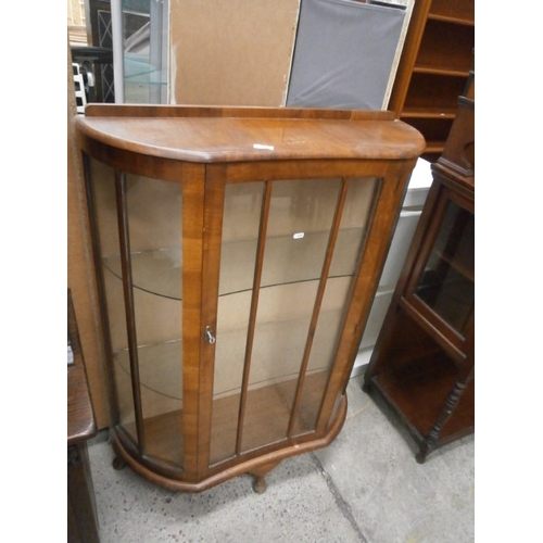 676 - A vintage glazed walnut display cabinet