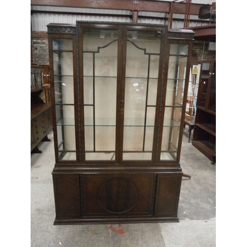 708 - A large antique 2 door glazed mahogany cabinet with 4 door cupboard base