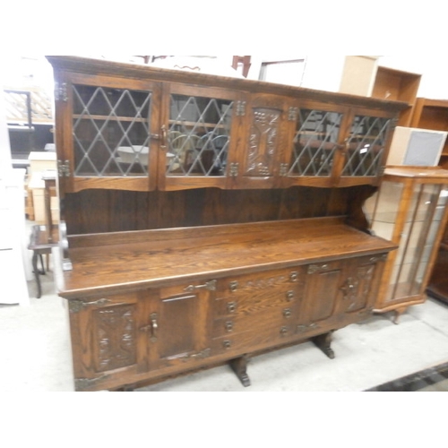 709 - A vintage WEBBER ornately carved oak 2 part dresser with 4 drawer sideboard base and lead glazed top... 