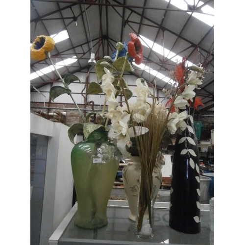 315 - Four assorted vases containing artificial flowers