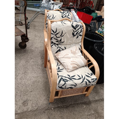 716 - A pair of wood framed conservatory armchairs with cushions