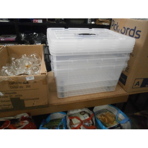 122 - Three plastic storage boxes with lids and spare lid