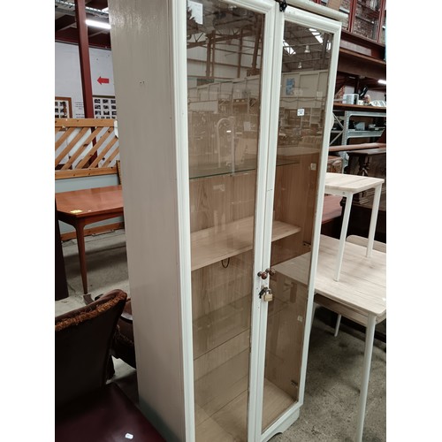 682 - A large painted glazed 2 door cabinet