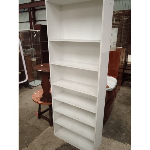 684 - A white 7 tier open shelf unit