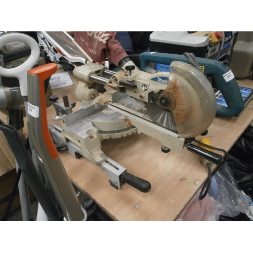 235 - Makita mitre saw, working