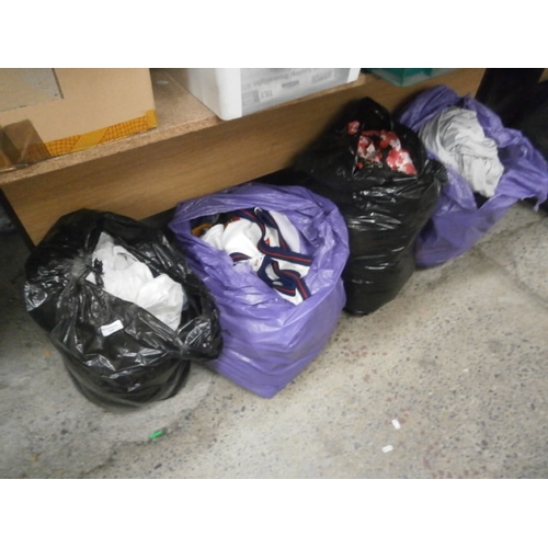 144 - Four bags of assorted clothing