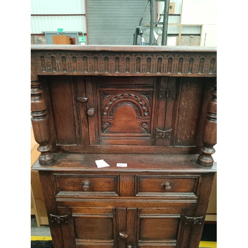 615 - A small vintage carved oak court cupboard with drawer