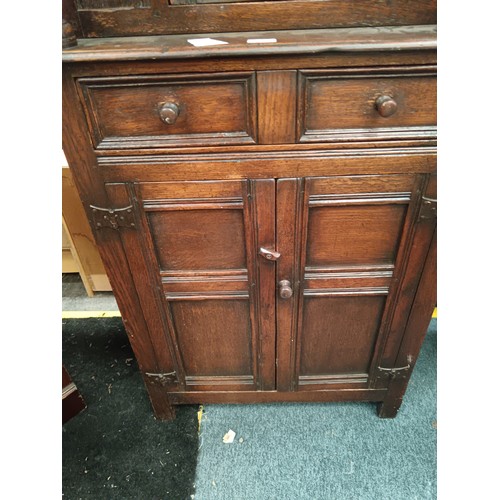 615 - A small vintage carved oak court cupboard with drawer