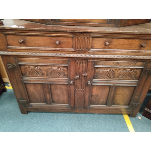 616 - A large ornately carved oak 2 drawer court cupboard