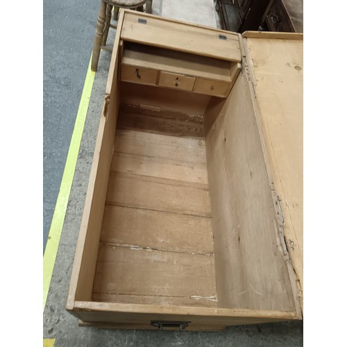 658 - A large vintage lift top storage box with fitted interior