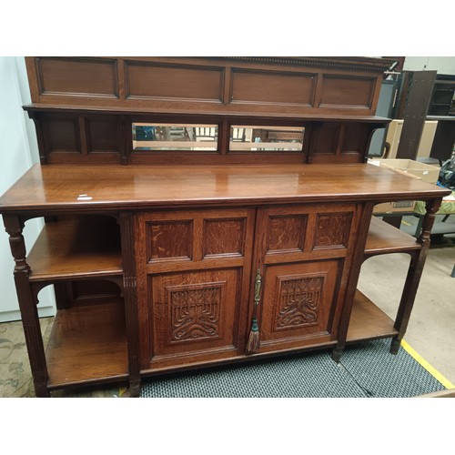 633 - A large vintage ornately carved oak mirror backed sideboard with 2 door cupboard base