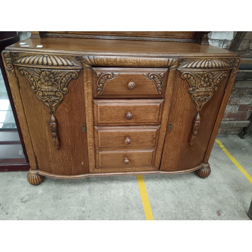 785 - A vintage ornately carved oak 4 drawer sideboard with bulbous carved upstand supports