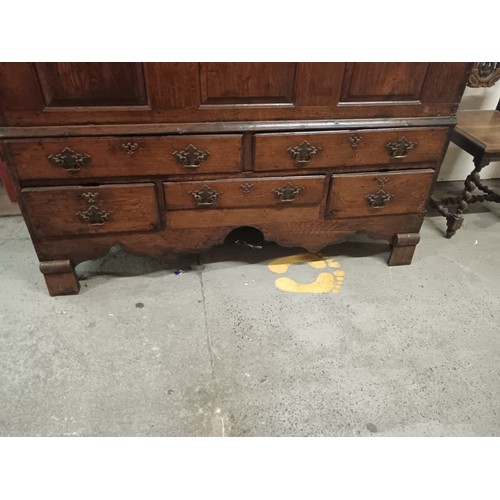 802 - A large antique oak lift top coffer on 5 drawer base