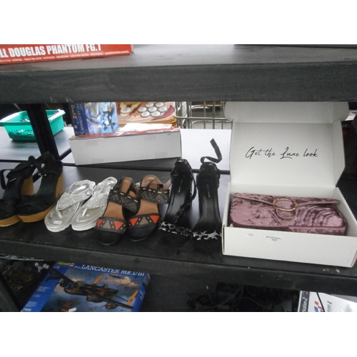 122 - Four pairs of footwear and handbag