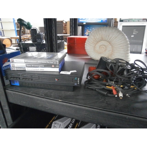 142 - PS2 with controllers and three games