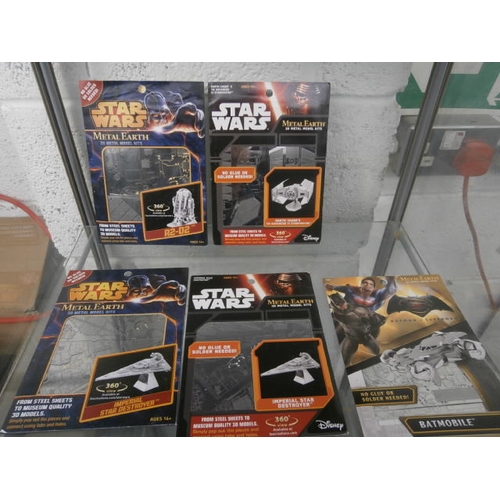 175 - Four Star Wars metal earth model kits and Batmobile metal model kit