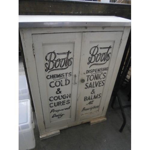 606 - A vintage painted wooden 2 door cupboard with 
