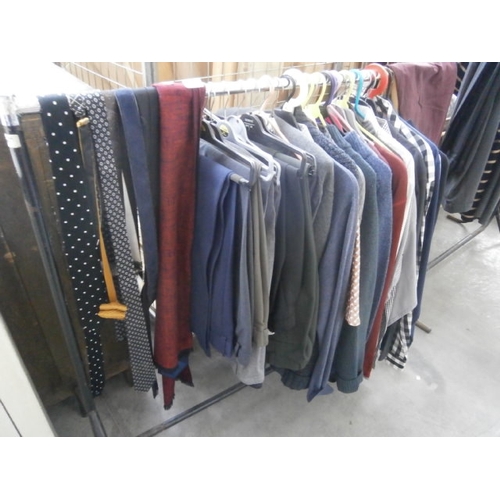 607 - A rail of assorted clothing - rail not included