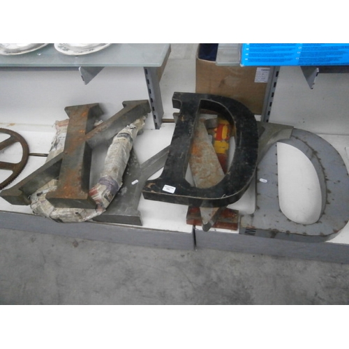 165 - Seven metal letters