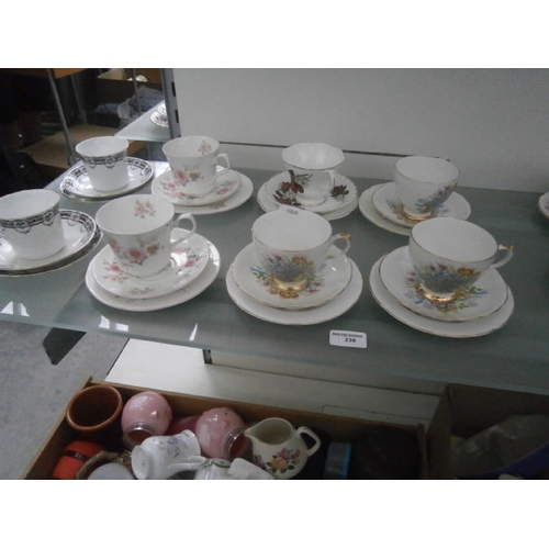 236 - Eight assorted china trio sets