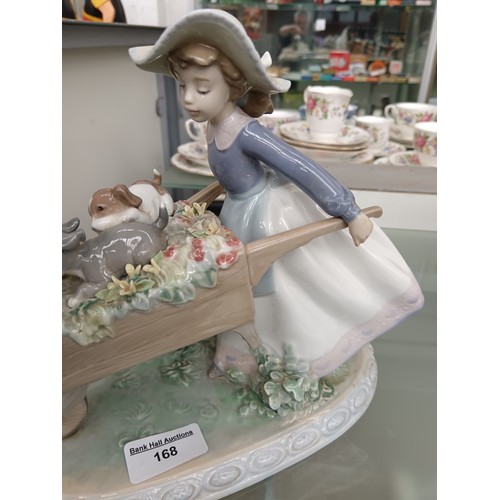 168 - LLADRO girl pushing barrow of flowers ornament