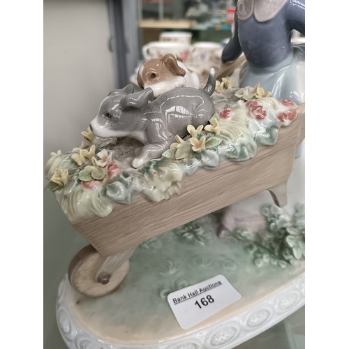 168 - LLADRO girl pushing barrow of flowers ornament