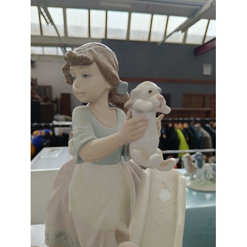 229 - LLADRO girl with puppies on slide ornament with box. 10.5