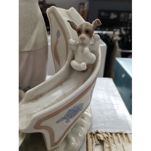 229 - LLADRO girl with puppies on slide ornament with box. 10.5