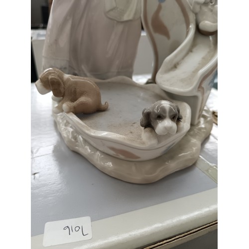 229 - LLADRO girl with puppies on slide ornament with box. 10.5