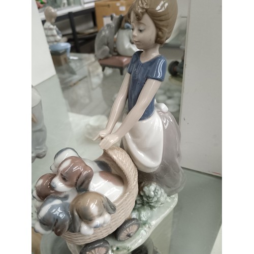 191 - LLADRO girl pushing basket of dogs ornament