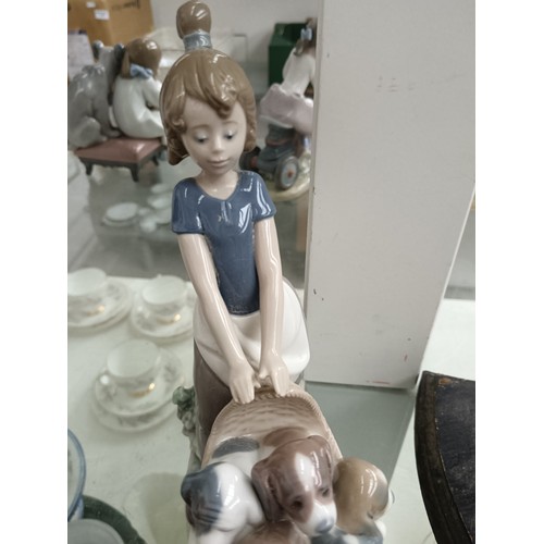 191 - LLADRO girl pushing basket of dogs ornament