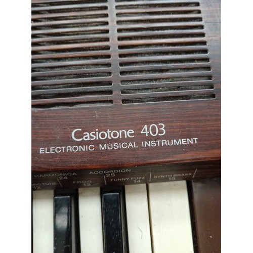 613 - A CASIOTONE 403 keyboard on stand