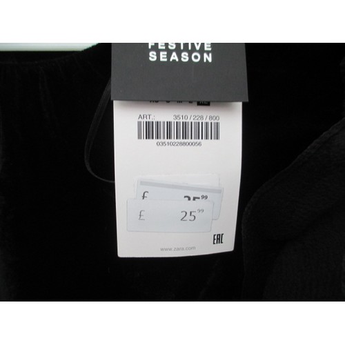 254 - Box of new Zara items inc boots, knee boots, coat, shirts, dress. Value of items £296